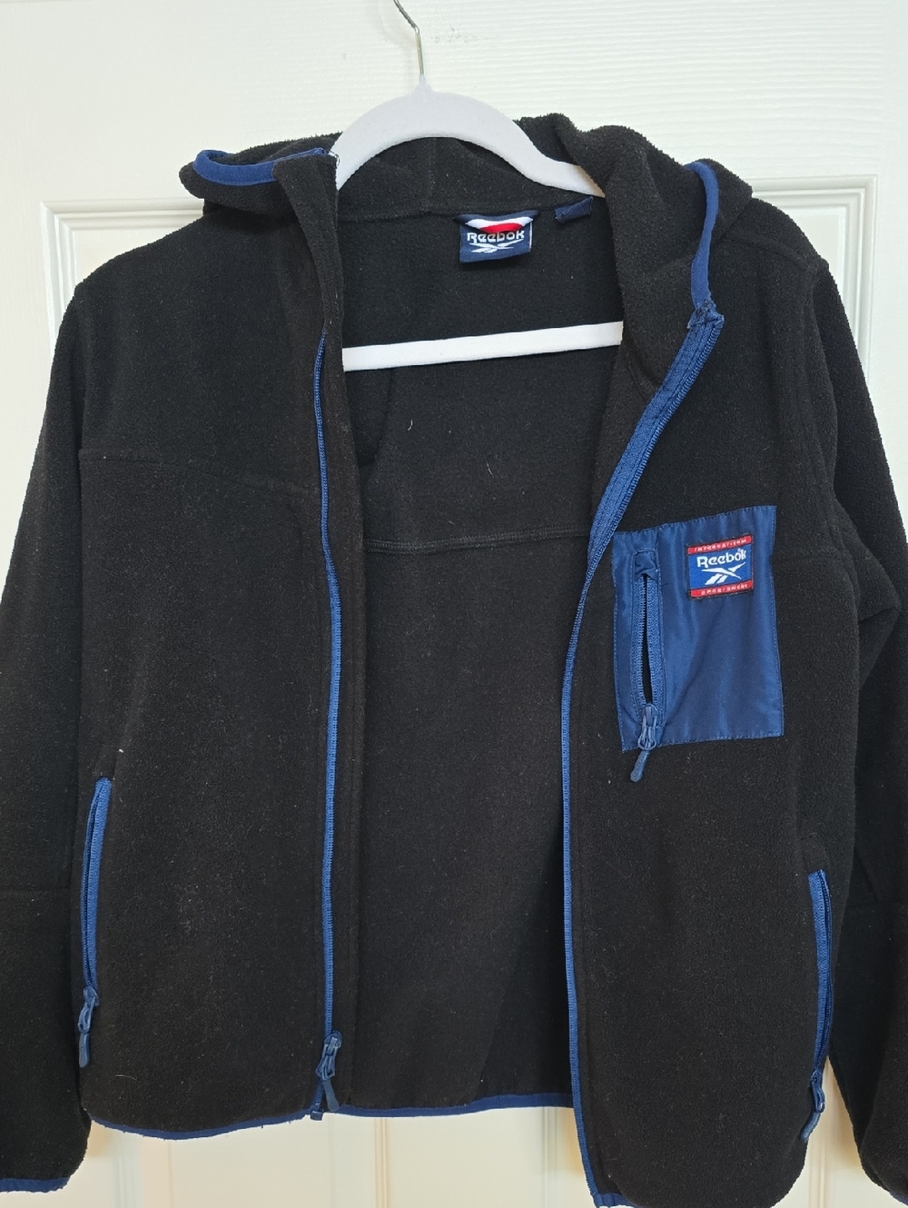 Reebok Hooded Boy's Black Fleece Jacket with Blue Accents